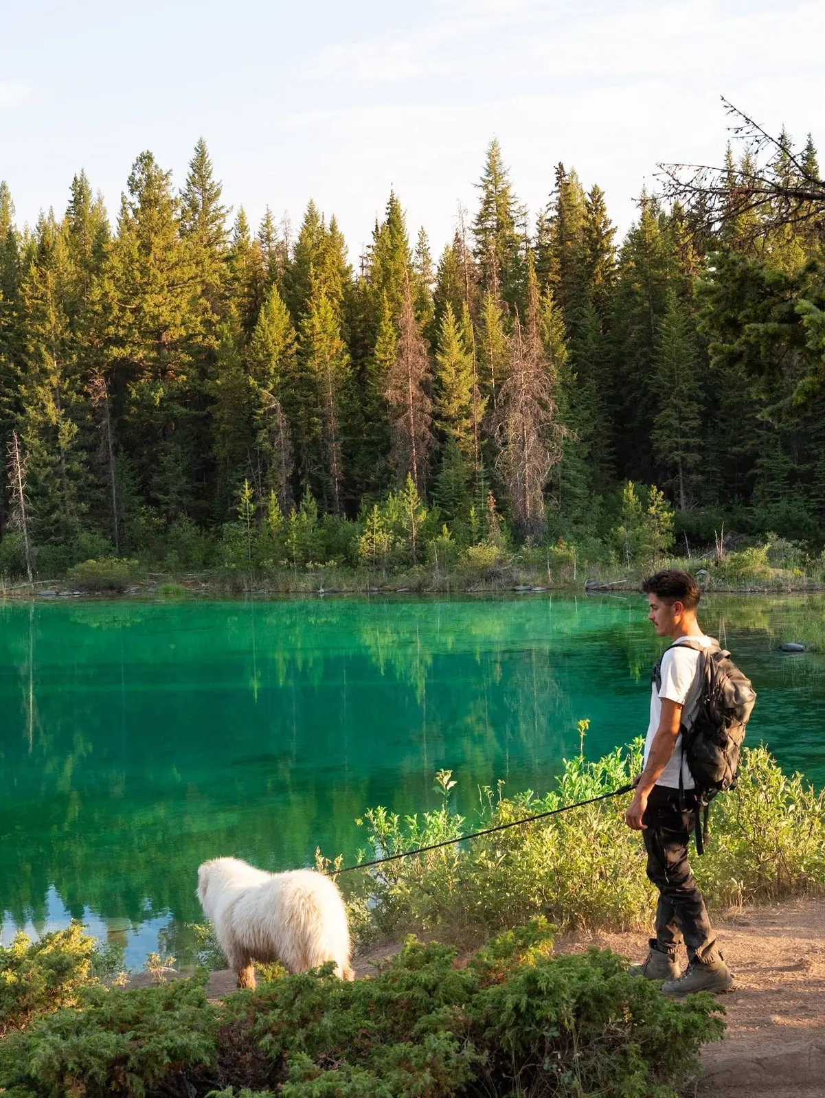 Anthony and Saiko by an emerald lake